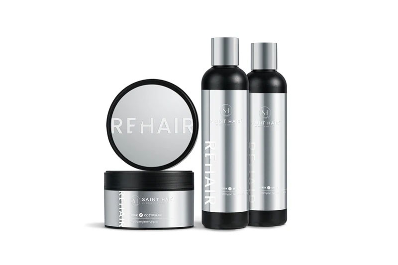 Profesjonalna fotografia produktowa: zestaw kosmetyków do włosów Saint Hair REHAIR (maska, szampon, odżywka), luksusowy packshot na białym tle z odbiciem.