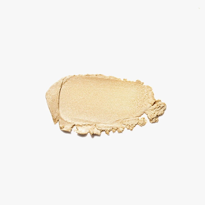 Profesjonalne zdjęcia swatchy kosmetyków w Warszawie - próbka złotego rozświetlacza na białym tle, wykonana przez studio Packshothouse.